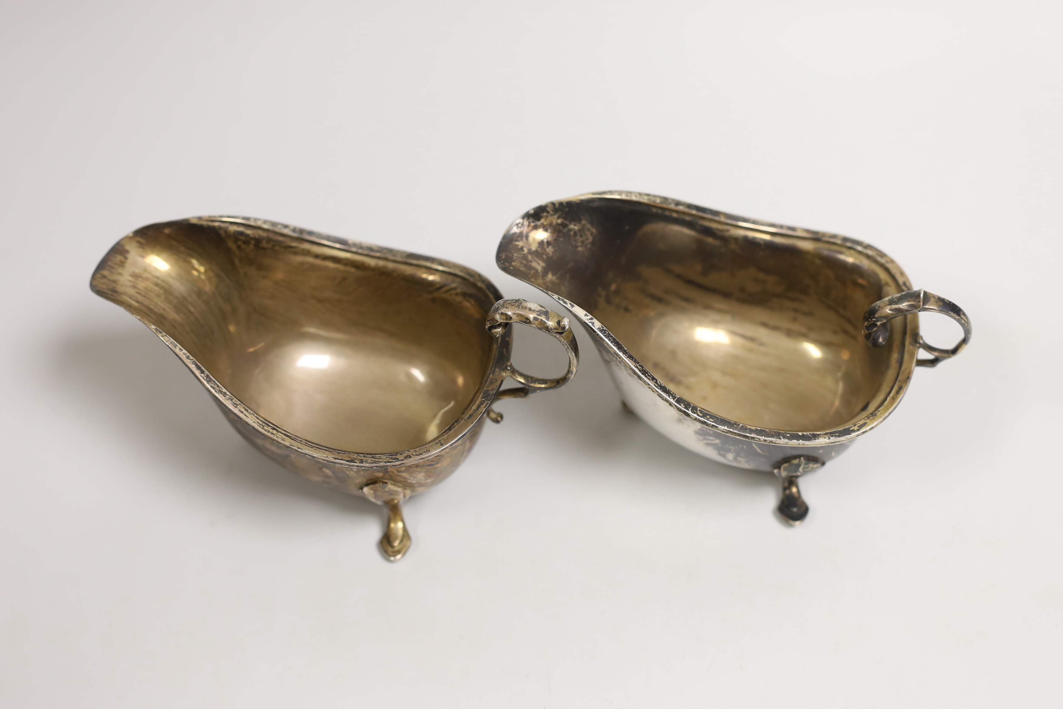 A pair of George VI silver sauce boats